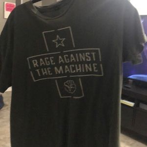 Olive colored rage against the machine T-shirt.